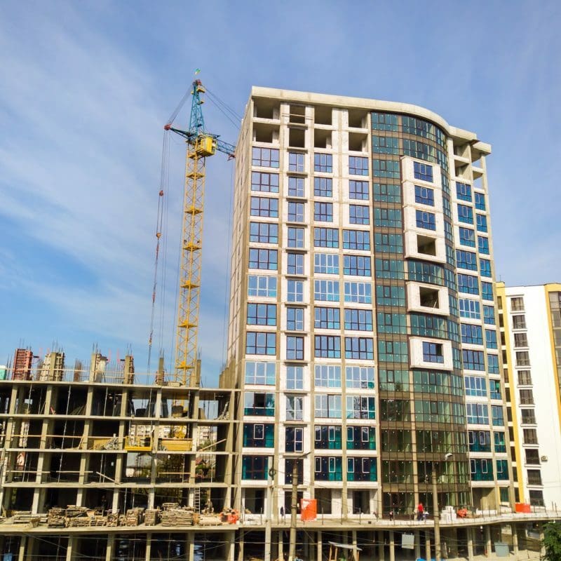 High residential apartment building under construction. Real estate development